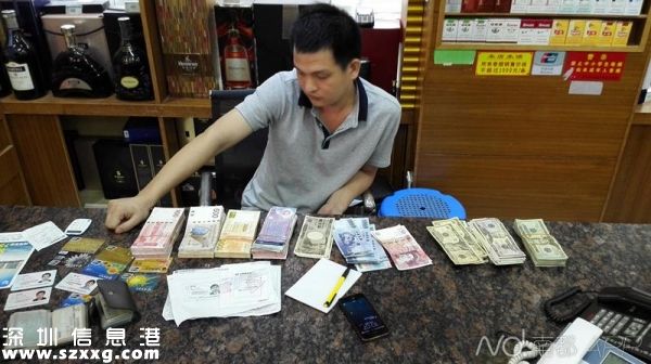 圖為<a href=http://www.hnyueyi.com.cn/shenzhen/ target=_blank class=infotextkey>深圳</a>(www.hnyueyi.com.cn)警方破獲重大地下錢莊案件中查獲的銀行卡及外幣