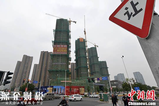 資料圖 一處商品房在建中。 中新社記者 呂明 攝